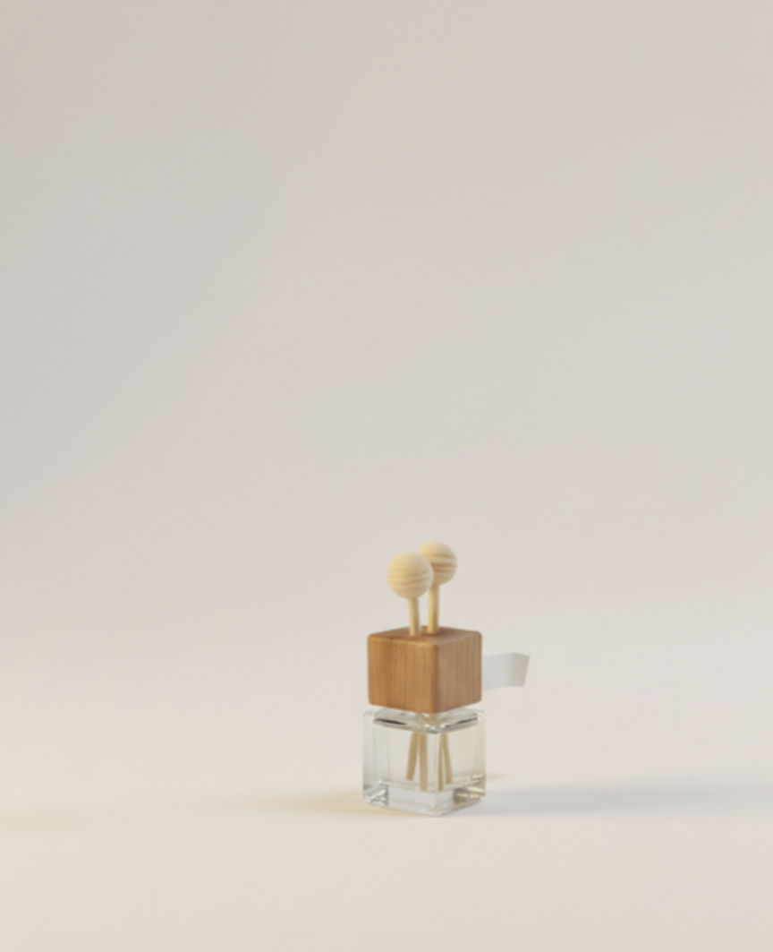 Small clear glass diffuser bottle with a wooden cap and vents topped with two round beads, set against a light beige background.