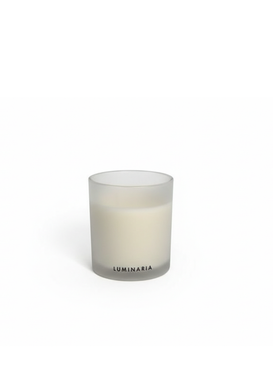 Frosted glass candle jar with LUMINARIA branding on a white background.