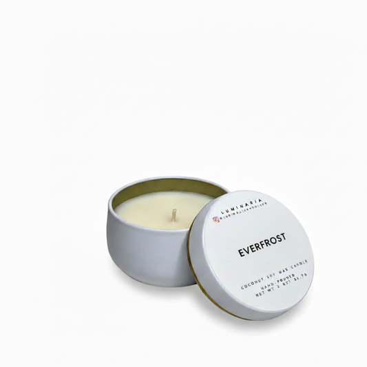 Open white metal tin candle with lid labeled 'Everfrost' placed on a white background
